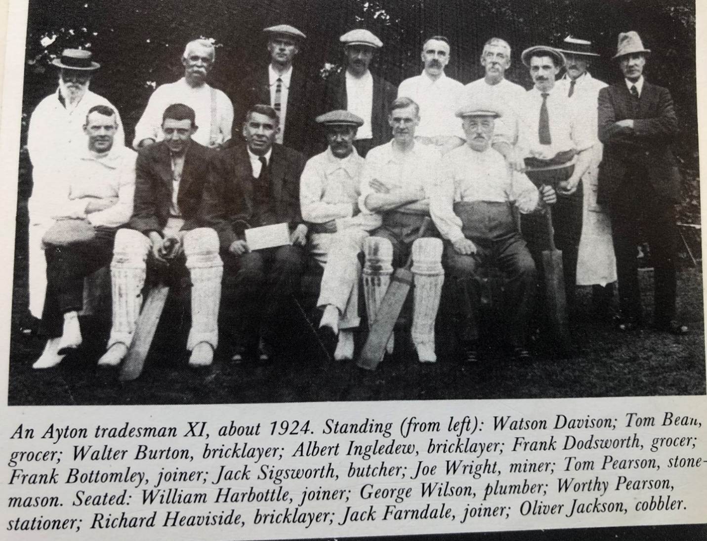 A group of people posing for a photo
Description automatically generated
